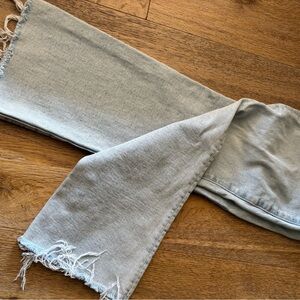 MOTHER High Rise Jeans in light blue.